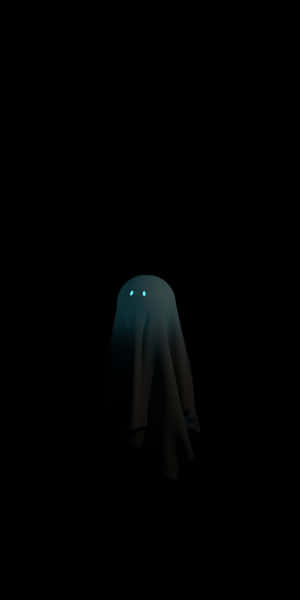 Mysterious_ Ghostly_ Figure_ Dark_ Background.jpg Wallpaper