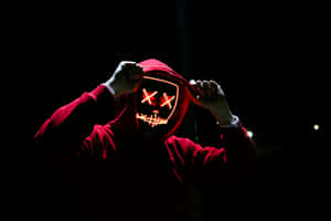 Mysterious Hooded Figurewith Neon Mask4k.jpg Wallpaper