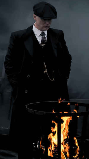 Mysterious Man Beside Fire Barrel Wallpaper