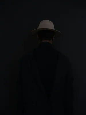 Mysterious_ Man_in_ Hat_and_ Coat Wallpaper