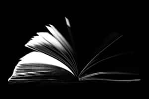 Mysterious_ Open_ Book_ Black_ Background.jpg Wallpaper