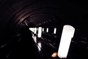 Mysterious Shadows In Dark Underground Tunnel Wallpaper