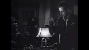 Mysterious Silhouettes In Foggy Alley Wallpaper