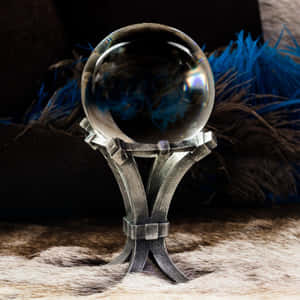 Mystical Crystal Ball On Wooden Table Wallpaper