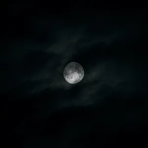 Mystical Dark Moon Illuminating The Night Sky Wallpaper