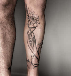 Mystical_ Figure_ Tattoo_on_ Leg Wallpaper