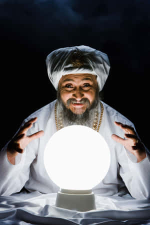 Mystical Fortune Teller With Crystal Ball Wallpaper