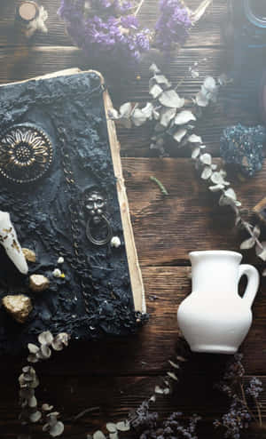 Mystical Grimoire In An Enchanted Library Wallpaper