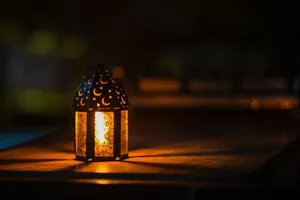 Mystical Lantern Glowingat Night Wallpaper
