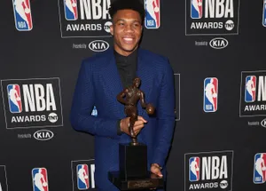 N B A Awards Ceremony Winner Holding Trophy Wallpaper