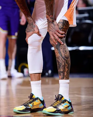 N B A Player Tattooed Legs Courtside Wallpaper