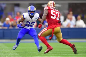 N F L Action Ramsvs49ers Wallpaper