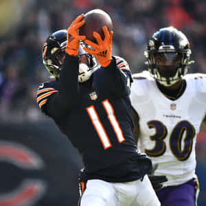 N F L Receiver Catching Football Wallpaper