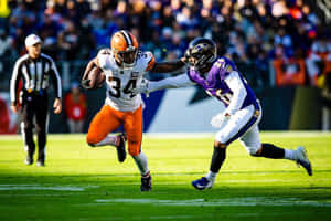 N F L Running Back Evades Defender Wallpaper