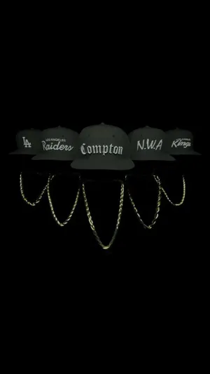 N.w.a. Group Merch Hats And Blings Wallpaper