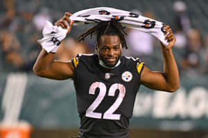 Najee Harris Celebratingon Field Wallpaper