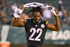 Najee Harris Celebratingon Field Wallpaper