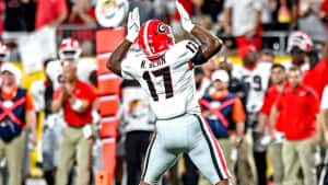 Nakobe Dean Celebrationon Field Wallpaper