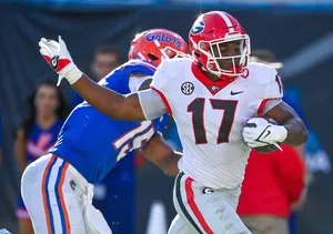 Nakobe Dean Georgia Linebacker Action Wallpaper