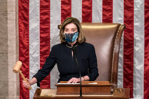 Nancy Pelosi Holding A Gavel While Wearing A Mask Wallpaper