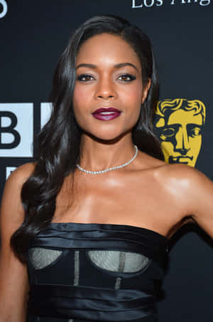 Naomie Harris Possing At A Red Carpet Event Wallpaper