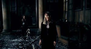 Narcissa Malfoy Standing In Dark Room Wallpaper