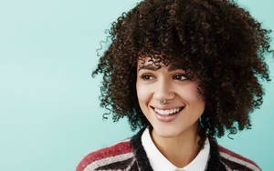 Nathalie Emmanuel Showcasing Her Stunning Smile Wallpaper