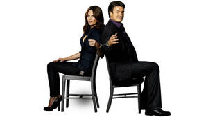 Nathan Fillion Stana Katic Sitting Down Wallpaper