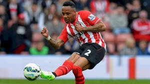 Nathaniel Clyne Kicking A Ball Wallpaper