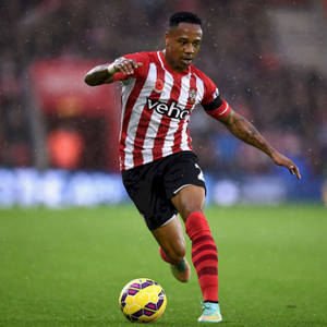 Nathaniel Clyne Kicking A Ball Wallpaper