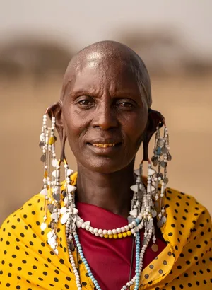 Native Woman Dressed In Traditional Attire Wallpaper