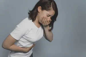 Nauseous Woman In White Shirt Wallpaper