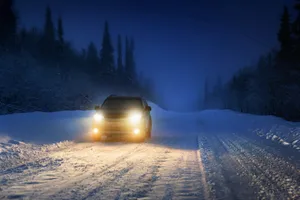 Navigating Snowy Roads On A Winter Day Wallpaper