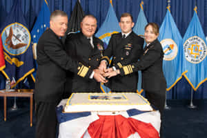 Navy Officers Celebratingwith Cake Wallpaper