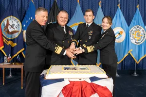 Navy Officers Celebratingwith Cake Wallpaper