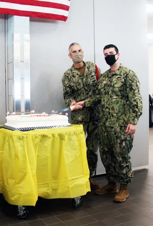 Navy Personnel Celebratingwith Cake Wallpaper