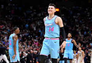 Nba Champion Tyler Herro Displays The Larry O'brien Trophy Wallpaper