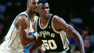 Nba Player David Robinson Blocking Alonzo Mourning Wallpaper