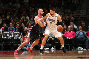 Nba Player Nikola Vucevic Orlando Magic Defense Wallpaper