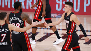 Nba Rookie Tyler Herro Shoots In A Packed Arena Wallpaper