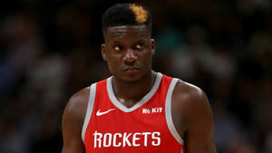 Nba Star Clint Capela Engaged In An Intense Game Wallpaper