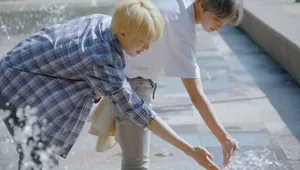 Nct 127 Jungwoo Haechan Playing With Water Wallpaper