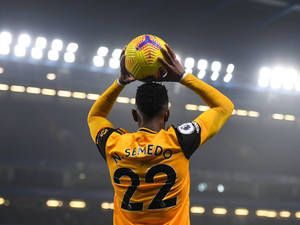 Nelson Semedo Holding The Ball Up Wallpaper