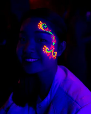 Neon_ Face_ Paint_ Under_ Black_ Light Wallpaper