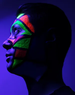 Neon_ Face_ Paint_ Under_ Black_ Light Wallpaper