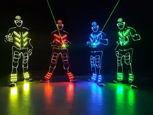 Neon Lit Dancers In Dark Room Wallpaper