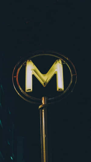 Neon Lit M Letter Sign Wallpaper