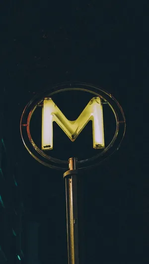 Neon Lit M Letter Sign Wallpaper
