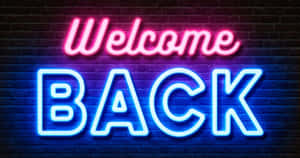 Neon Welcome Back Sign Wallpaper