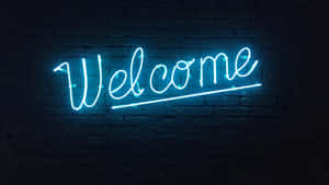 Neon Welcome Signon Brick Wall Wallpaper